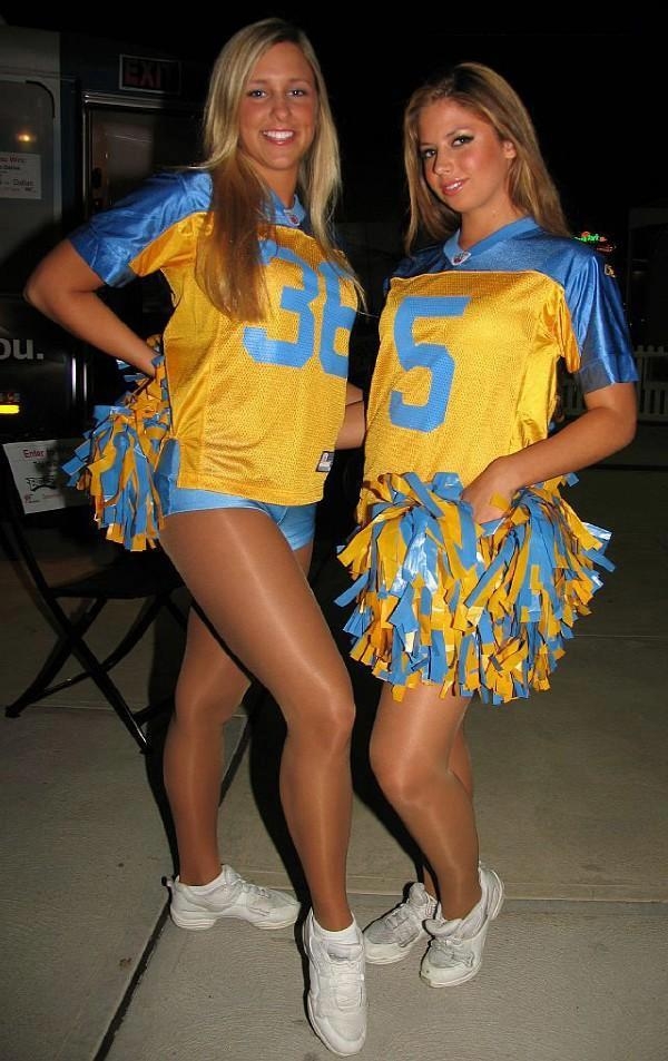 Two Blonde Pompom Girls wearing Tan Sheer Nylon Pantyhose, White Sneakers and Blue Shorts